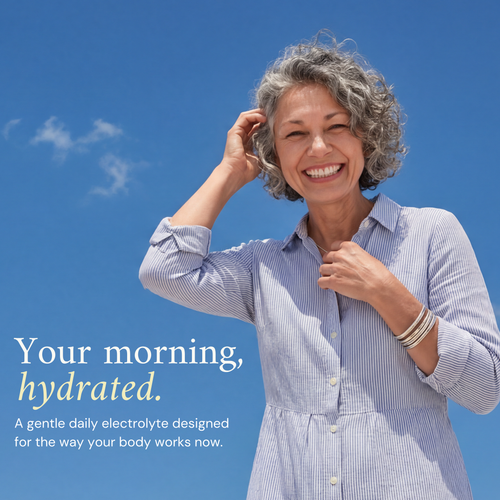 Woman in a light blue dress against a clear blue sky with promotional text about electrolytes.