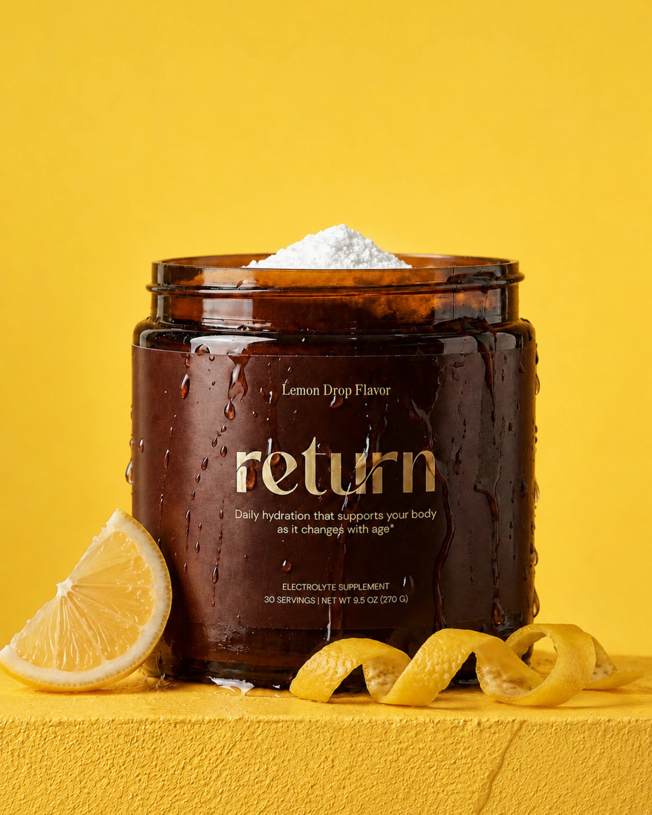 Open Lemon Drop jar with fresh lemon